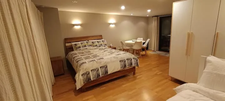 Private, self contained, near the airport and city
