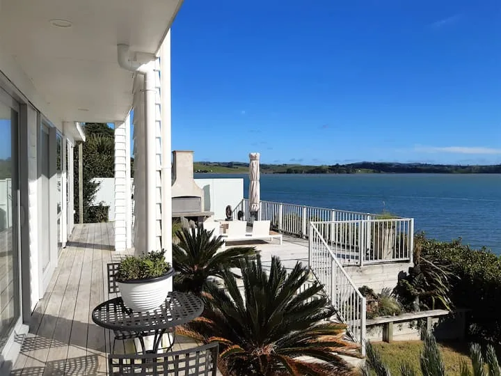 Serene Beachfront Magic: outdoor fireplace